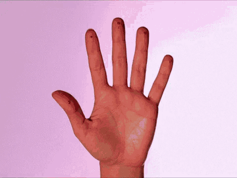 a close up of a person 's hand with blood on it 's fingers .