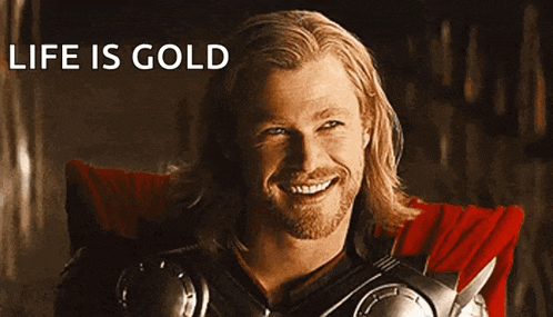 thor is smiling in front of a sign that says " life is gold "