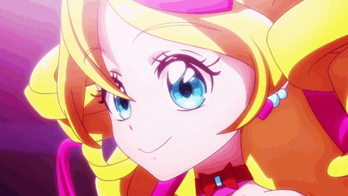 a close up of a cartoon girl with blue eyes