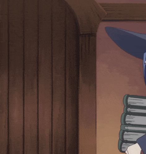 a witch wearing glasses and a hat with a c on it holds a stack of books