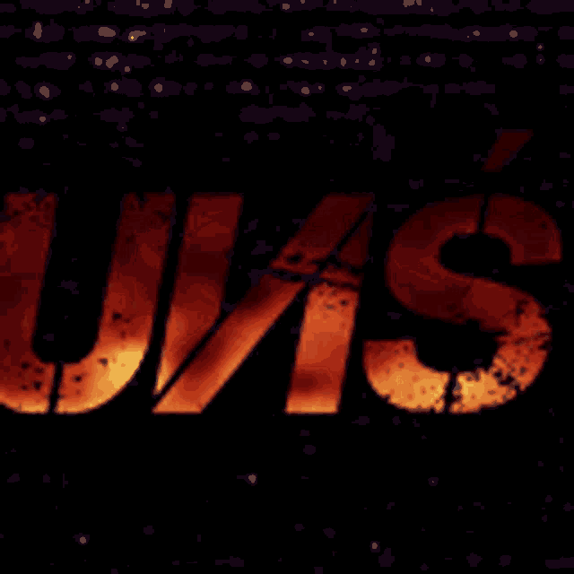 a dark background with the word u.v.s. written in orange