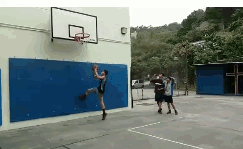a man playing basketball on a court with the word apex on the hoop