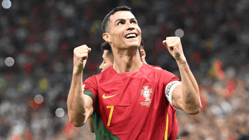 a soccer player with the number 7 on his jersey celebrates
