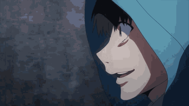 a close up of a person 's face with a blue hood on