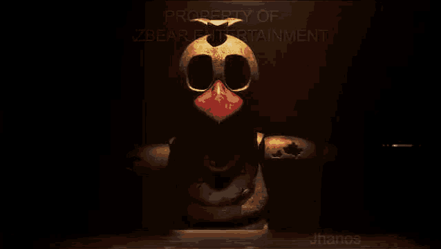 a chicken from five nights at freddy 's is sitting at a table .