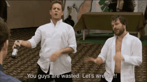 two men in white shirts are dancing with the words you guys are wasted let 's wrestle