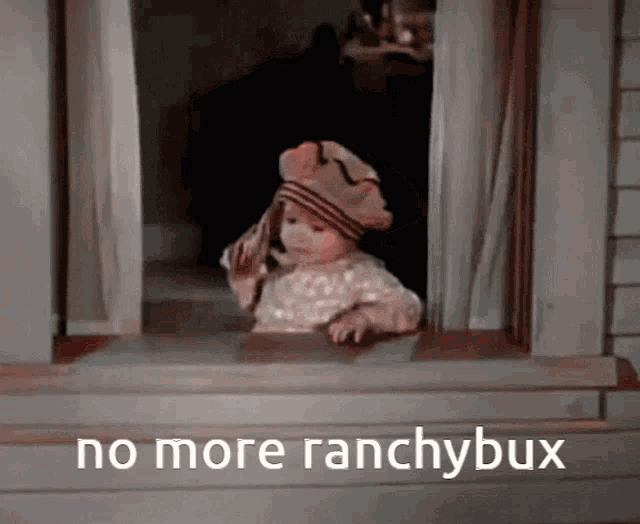 a baby looking out a window with the words no more ranchybux