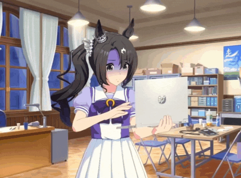 a girl in a purple and white dress holding a laptop