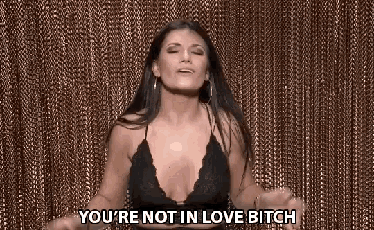 a woman in a bra is saying you 're not in love bitch