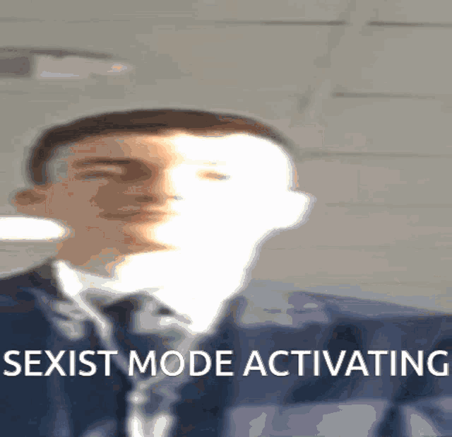 a blurred image of a man with the words sexist mode activating below him