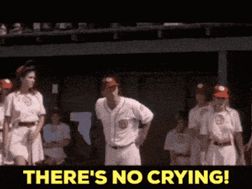 a group of baseball players standing in a dugout with the words " there 's no crying "