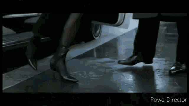 a close up of a person 's hand on a wheel of a car .