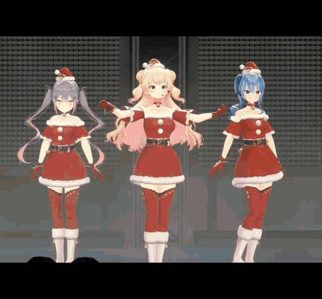 three anime girls dressed in santa costumes are dancing on a stage