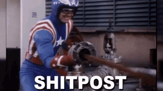 a man in a captain america costume is holding a hose in front of a pipe and the word shitpost is above him .