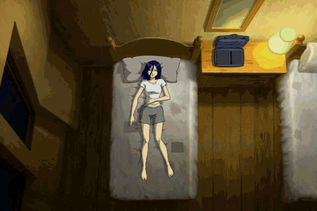a woman laying on a bed in a room