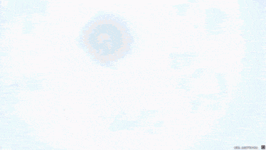 a blue sky with white clouds and a glowing circle in the middle