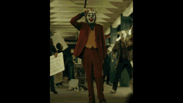 a man in a red suit is running in a hallway with the word banned written on the bottom