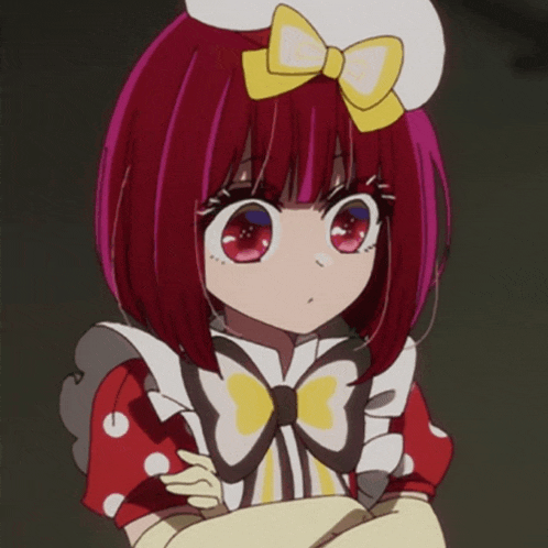 a red haired anime girl with a yellow bow on her head