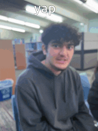 a blurry picture of a young man with the word yap written above him