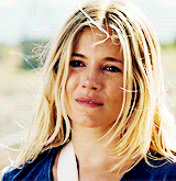 a close up of a woman with blonde hair