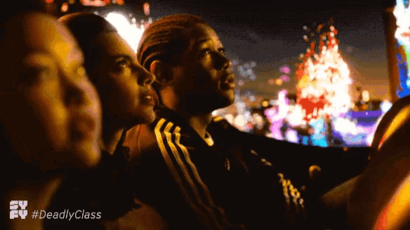 a group of people watching a movie with the hashtag #deadlyclass on the bottom