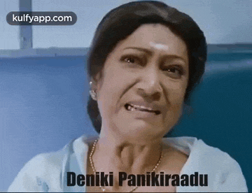 a woman is making a funny face and crying in a hospital room while wearing a necklace .