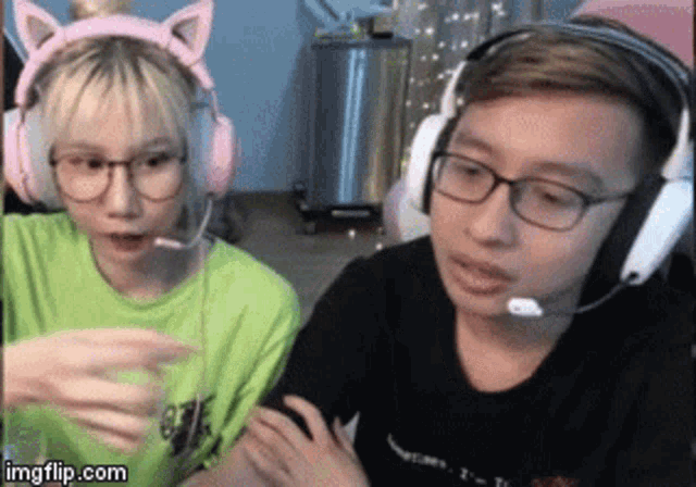 a man and a woman are wearing headphones and glasses .