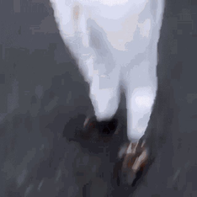 a blurry picture of a person wearing a baseball uniform .