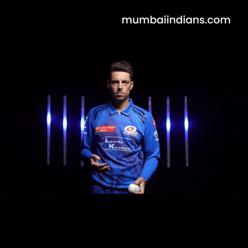 a blurry picture of a man 's face with the website mumbaiindians.com in the upper right corner