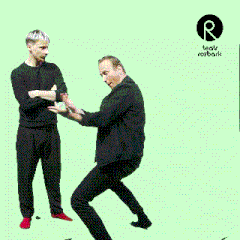 two men are standing next to each other with a logo for teatr rozbark in the corner