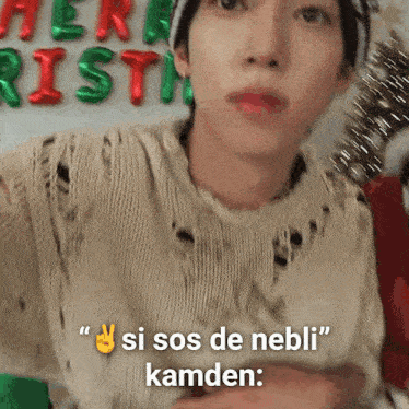 a man is wearing a sweater and a hat and says si sos de nebli kamden