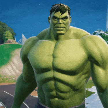 a green hulk is standing on a road