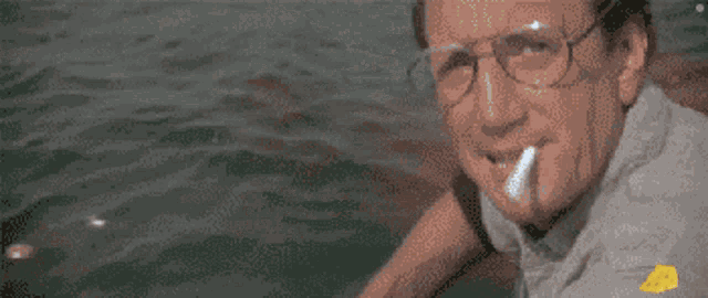 a pixelated image of a man smoking a cigarette with a drawing of a face behind him