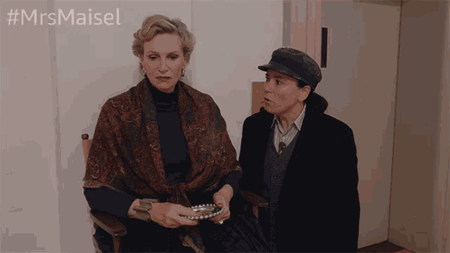 two women are standing next to each other with the hashtag #mrsmaisel behind them