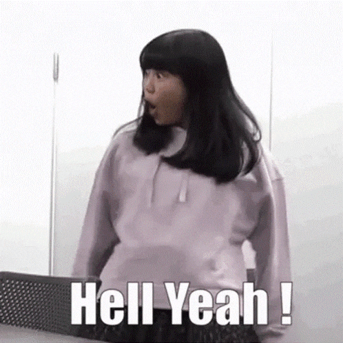 a girl is standing in front of a ping pong table with her mouth open and the words `` hell yeah ! ''