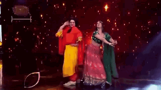 a man and a woman are dancing on stage .