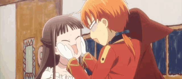 a boy and a girl are standing next to each other .