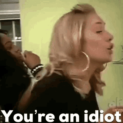 a woman is making a funny face with the words `` you 're an idiot '' written next to her .