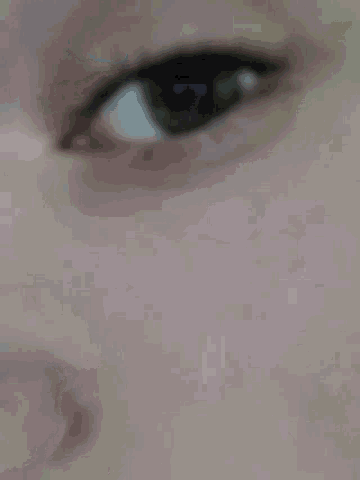 a close up of a person 's eye with a white background