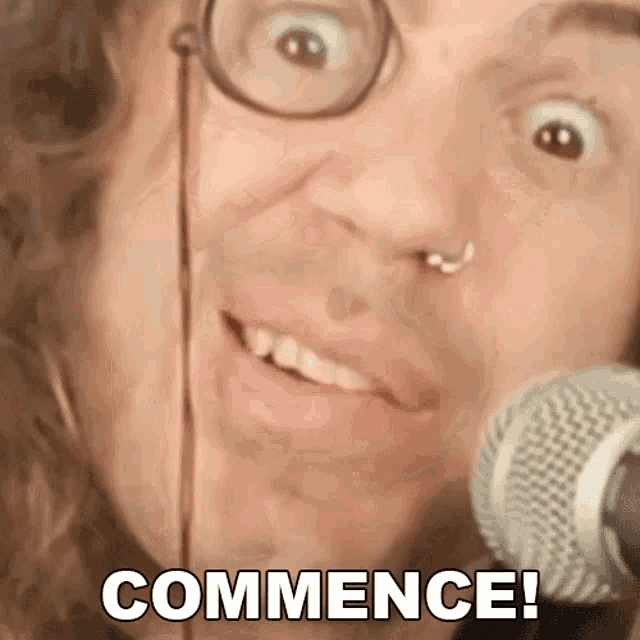 a close up of a person 's face with the words " commence " on the bottom