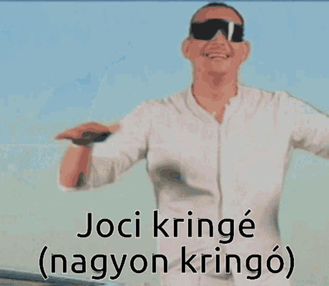 a man standing in front of an airplane with the words joci kringe ( nagyon kringo ) written below him