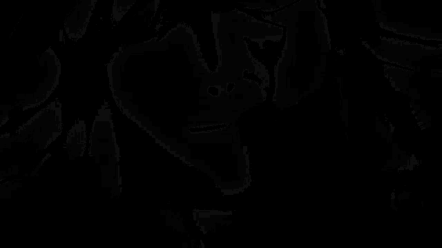 a black and white photo of a ghostly figure on a black background