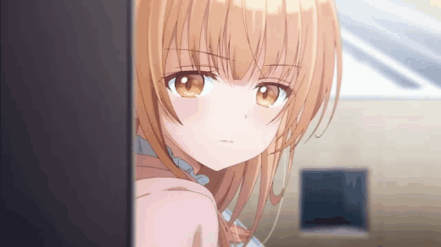 a close up of a girl 's face with brown hair