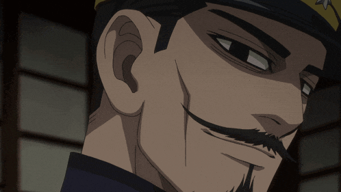 a close up of a man 's face with a beard