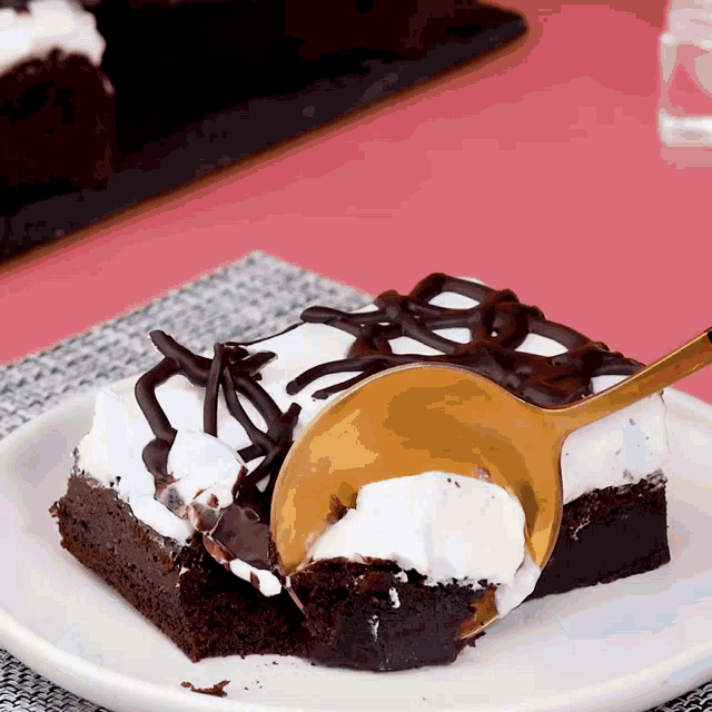 a piece of chocolate cake with whipped cream on top