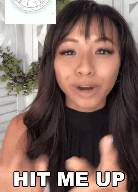 a woman says " hit me up " in front of a zodiac chart