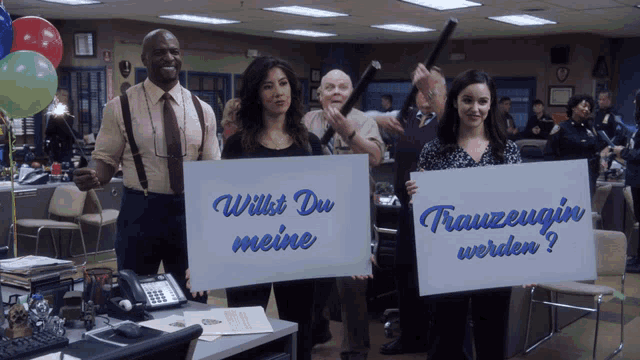 a group of people holding signs that say " willst du meine " and " frauzeugin werden "