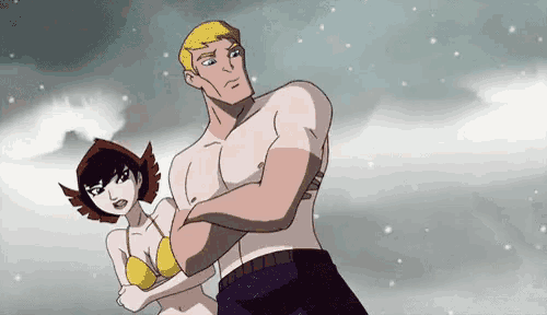a man and a woman are standing next to each other with their arms crossed .