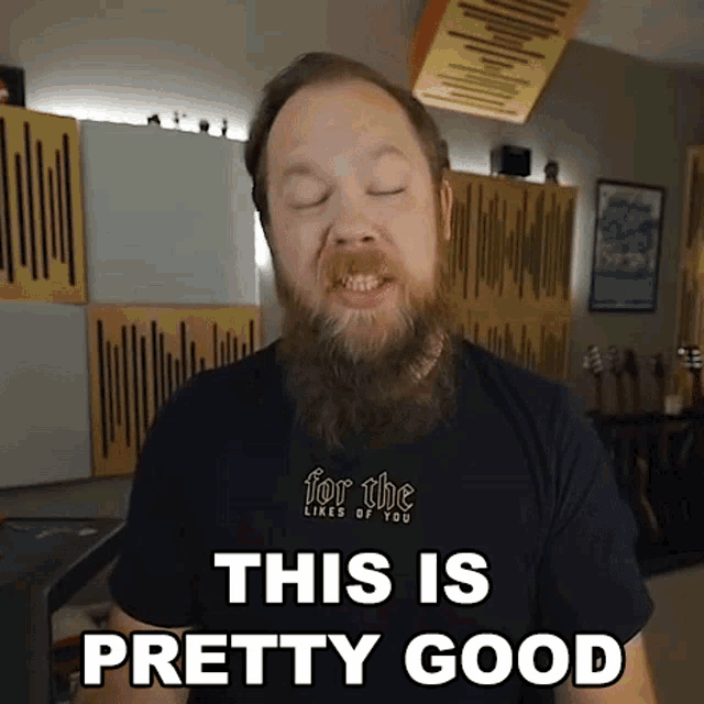 a man with a beard wearing a black shirt that says for the likes of you