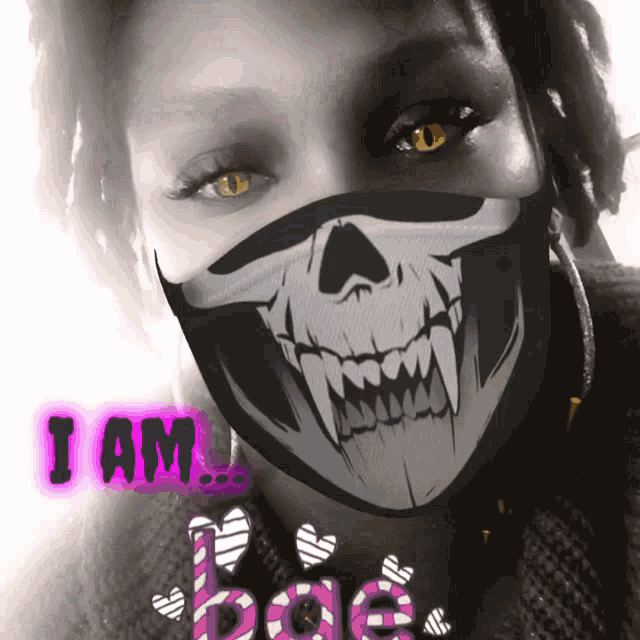 a woman wearing a mask with a skull on it and the words i am